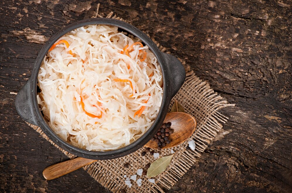 sauerkraut-with-carrot-in-wooden-bowl_2829-14044.jpg